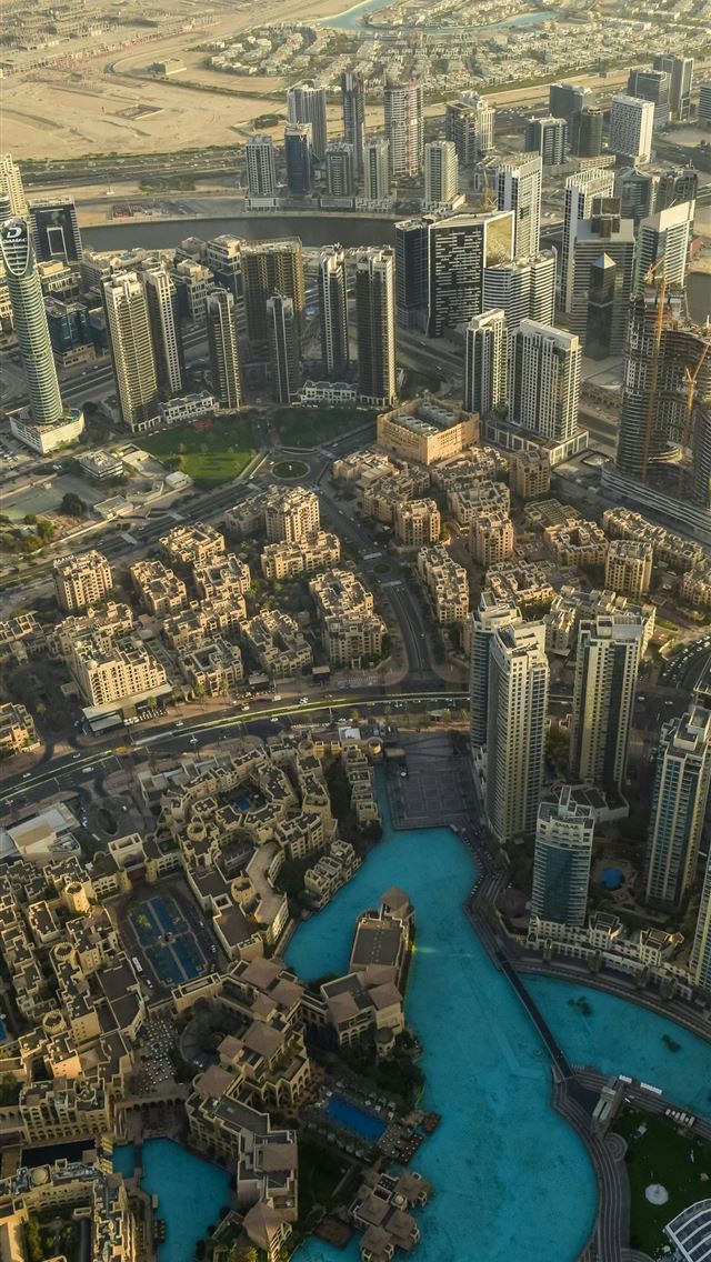 1290x2796 a river running through a city -  iPhone Wallpaper