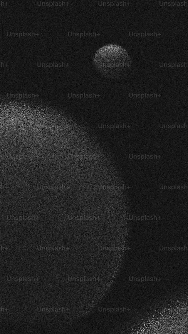 1125x2436 a black and white photo of two circles -  iPhone Wallpaper