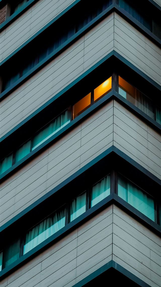 1290x2796 Corner of a modern building with illuminated windo... -  iPhone Wallpaper