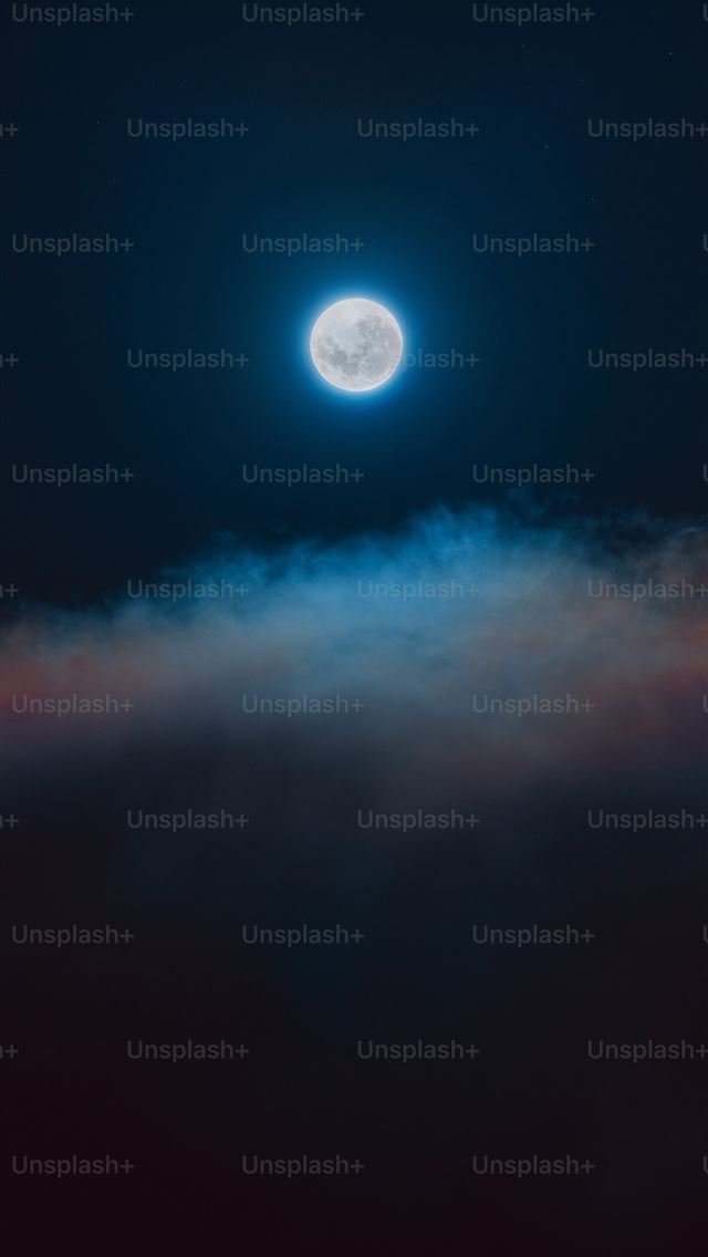 1290x2796 A full moon seen through the clouds in the night s... -  iPhone Wallpaper