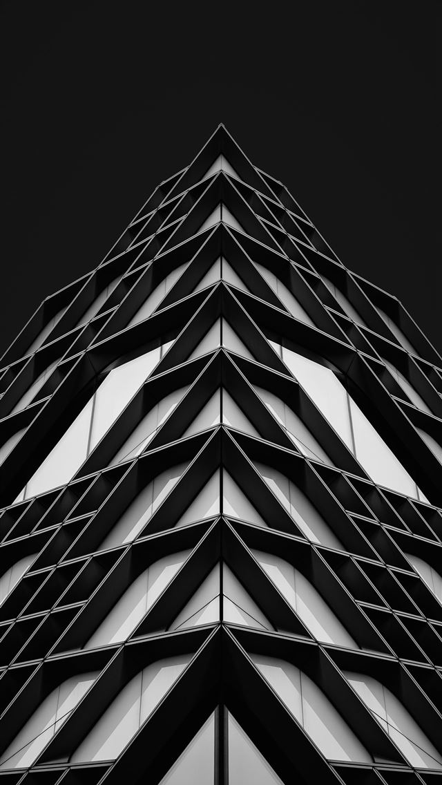 1290x2796 Modern geometric building facade against dark sky -  iPhone Wallpaper