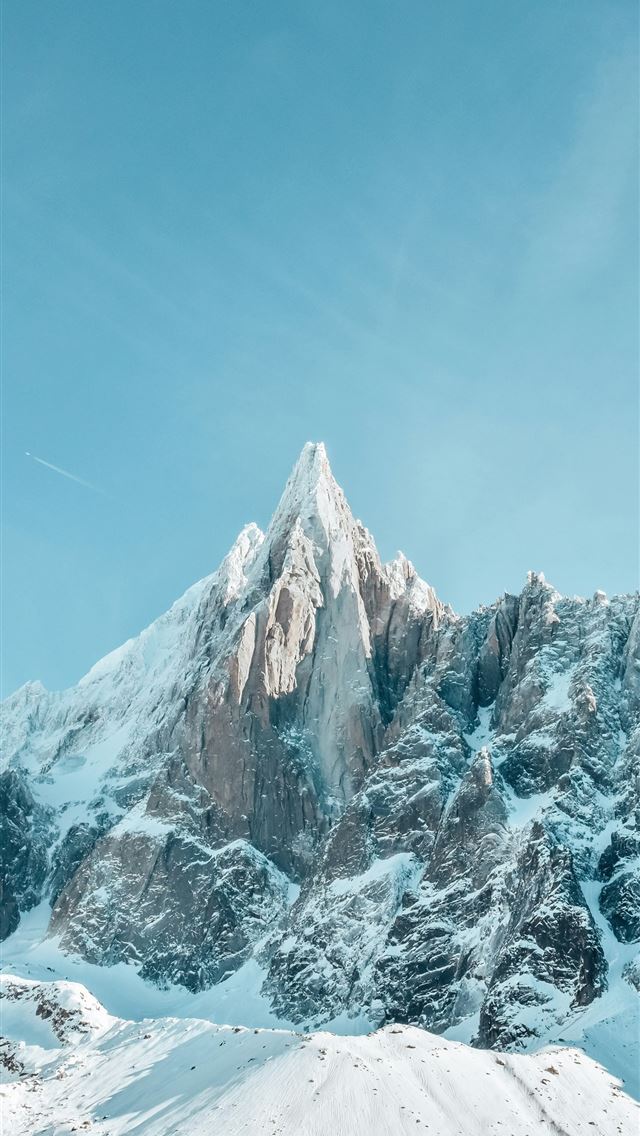 1290x2796 a mountain covered in snow under a blue sky -  iPhone Wallpaper