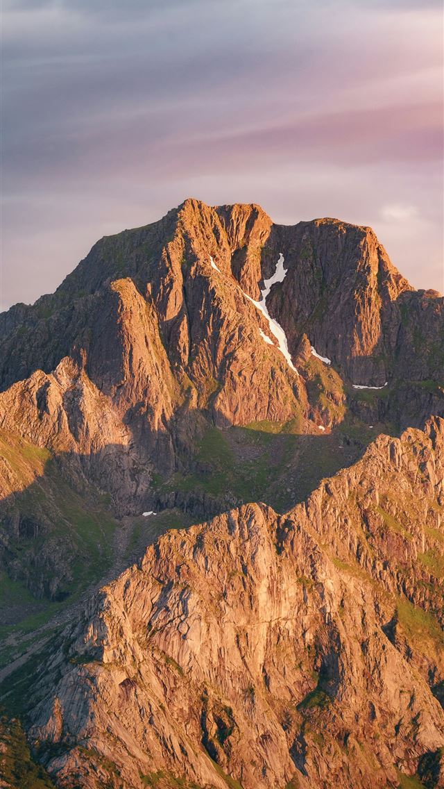 1290x2796 A very tall mountain with a sky background -  iPhone Wallpaper