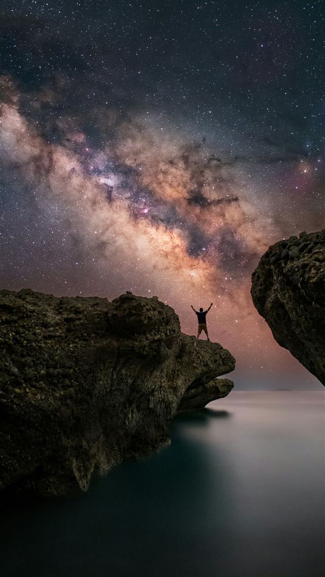 1290x2796 A person standing on a cliff looking at the stars -  iPhone Wallpaper