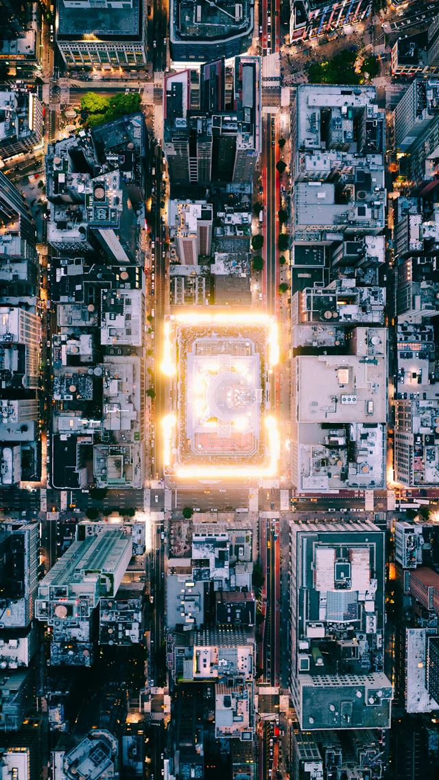 1290x2796 Aerial view of a brightly lit city at dusk  -  iPhone Wallpaper