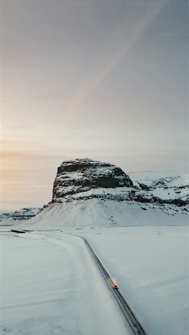 1290x2796 A truck driving down a snow covered road -  iPhone Wallpaper