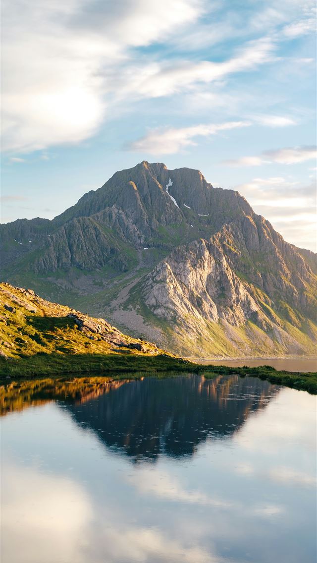 1290x2796 A mountain range with a lake in the foreground -  iPhone Wallpaper