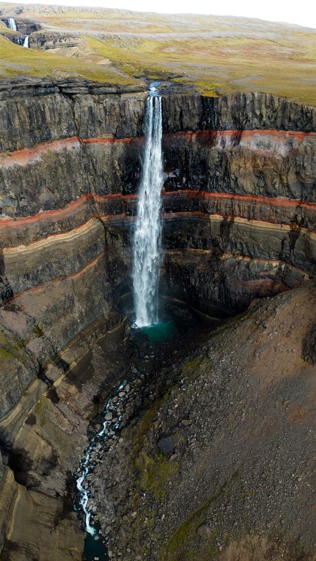 1290x2796 An aerial view of a waterfall in a canyon -  iPhone Wallpaper