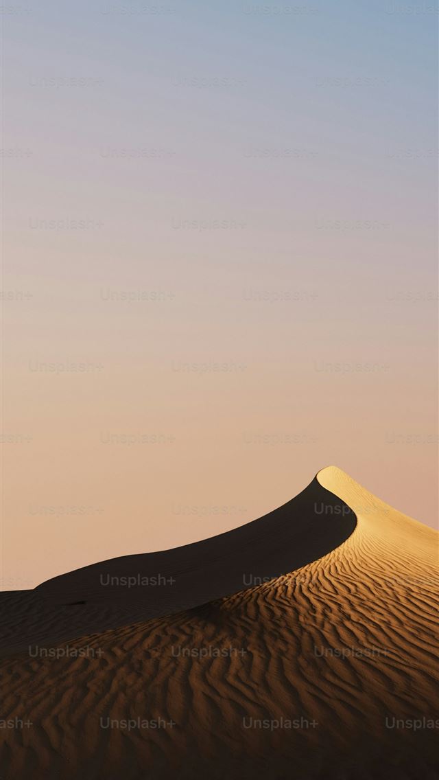 1290x2796 A sandy dune rises against a pastel sky  -  iPhone Wallpaper