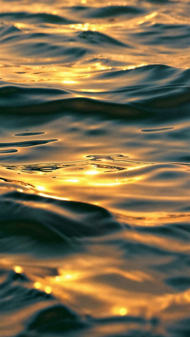 1290x2796 The sun is setting over the ocean water -  iPhone Wallpaper