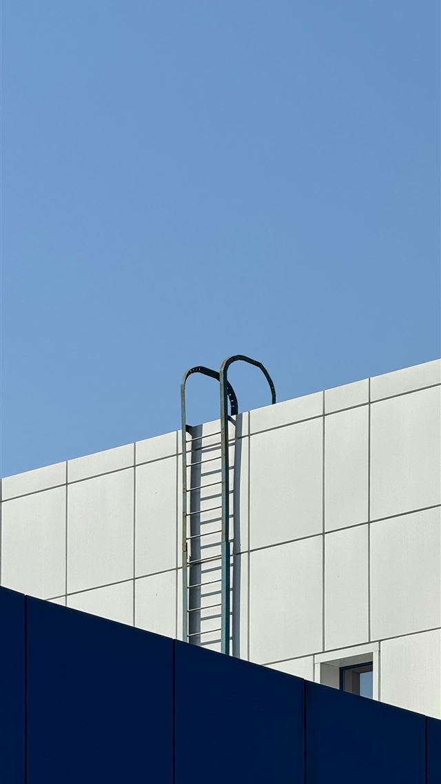 1290x2796 A tall building with a clock on the top of it -  iPhone Wallpaper