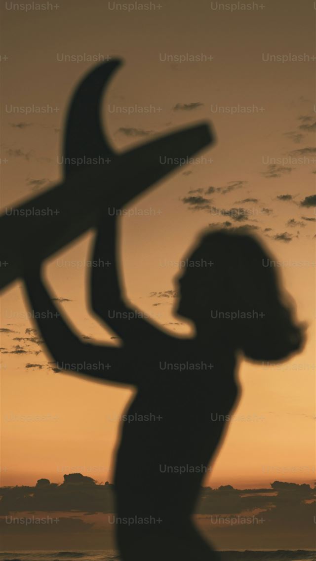 1290x2796 Silhouette of surfer with surfboard at sunset  -  iPhone Wallpaper