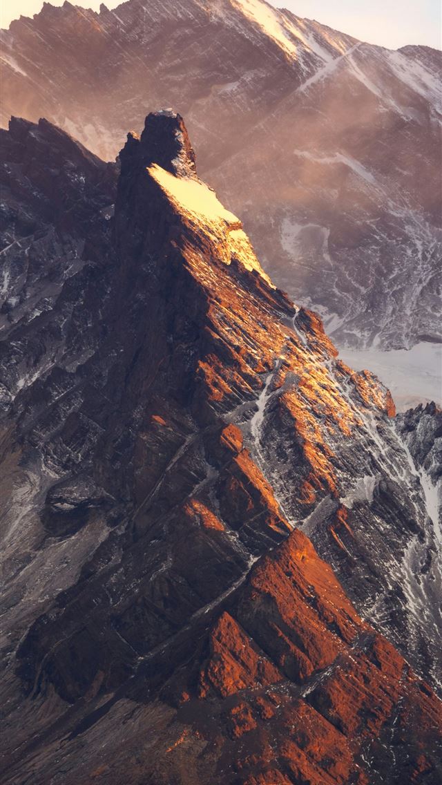 1290x2796 A view of a mountain with snow on it -  iPhone Wallpaper