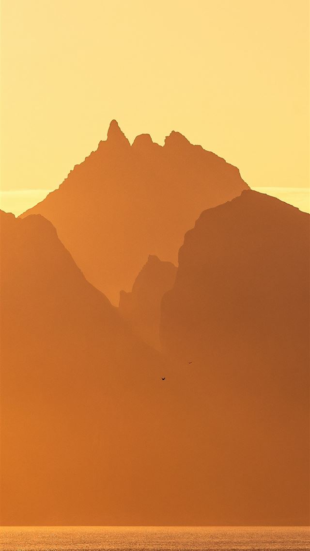 1290x2796 A large body of water with mountains in the backgr... -  iPhone Wallpaper