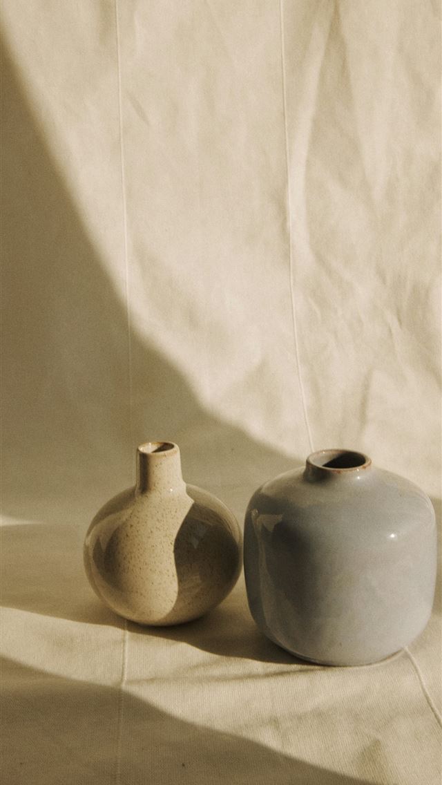 1290x2796 a couple of vases sitting on top of a table -  iPhone Wallpaper