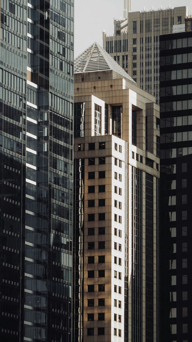 1290x2796 a view of some very tall buildings in the city -  iPhone Wallpaper