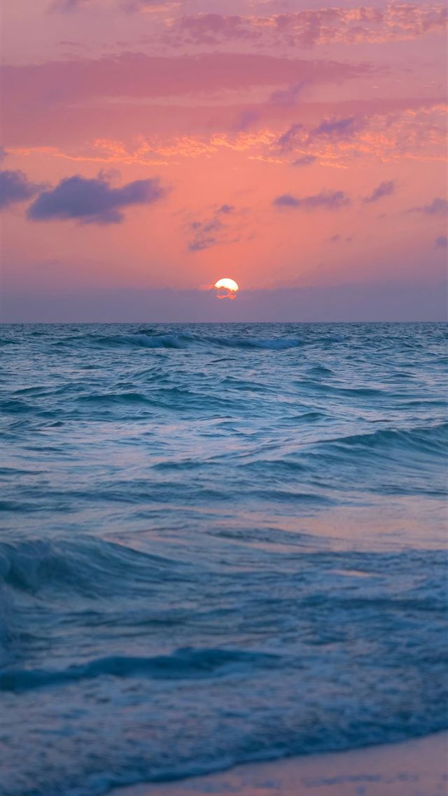 1290x2796 a beach with waves and a sunset -  iPhone Wallpaper
