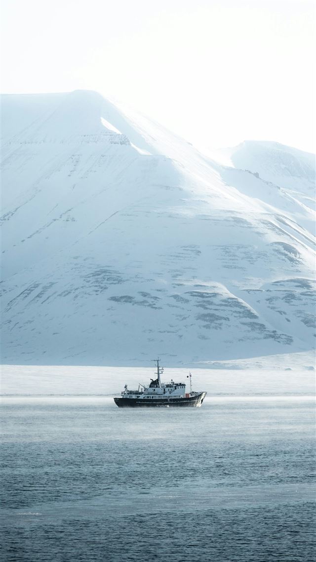 1290x2796 A boat in a large body of water -  iPhone Wallpaper
