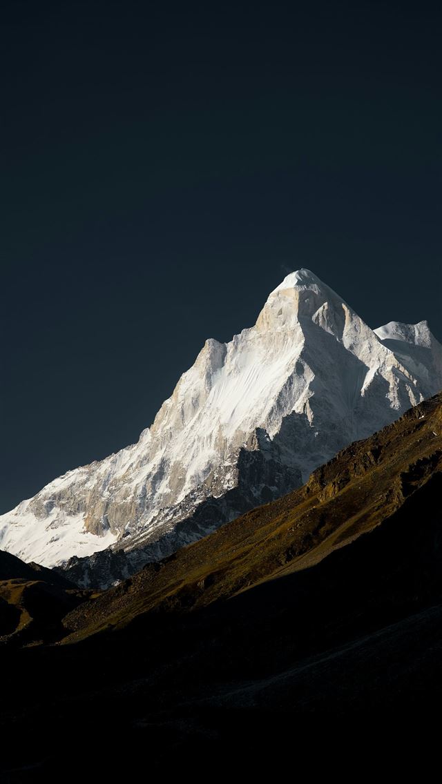 1290x2796 A snow covered mountain with a dark sky in the bac... -  iPhone Wallpaper