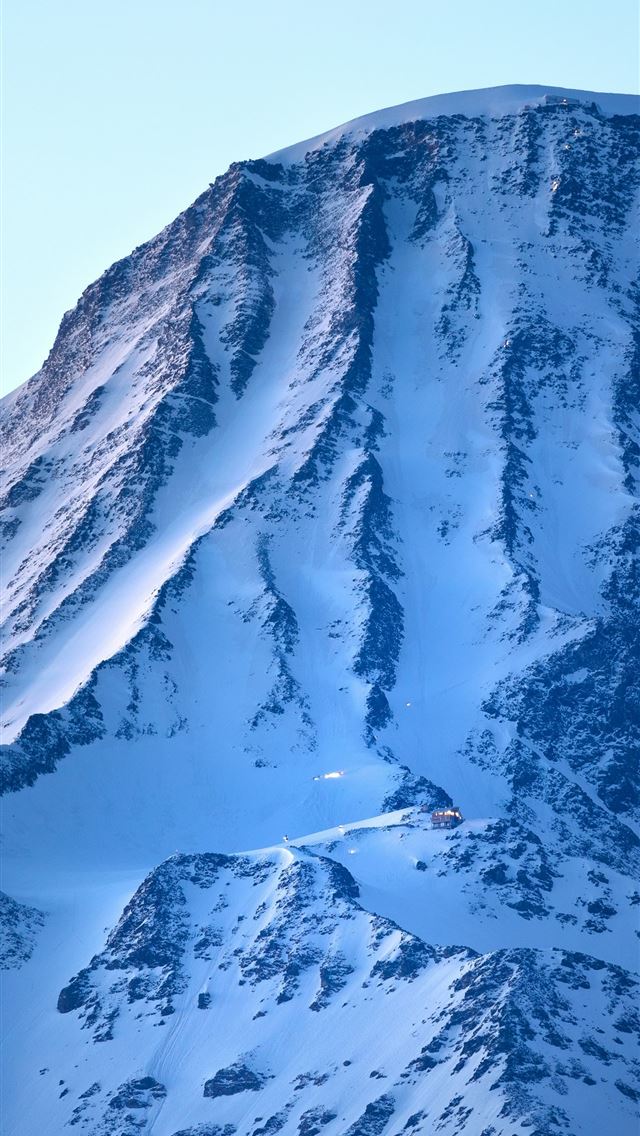 1290x2796 A snow covered mountain with a sky background -  iPhone Wallpaper