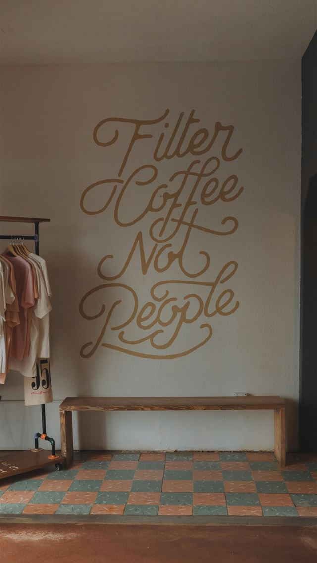 1290x2796 A clothing store with a sign that says filler coff... -  iPhone Wallpaper