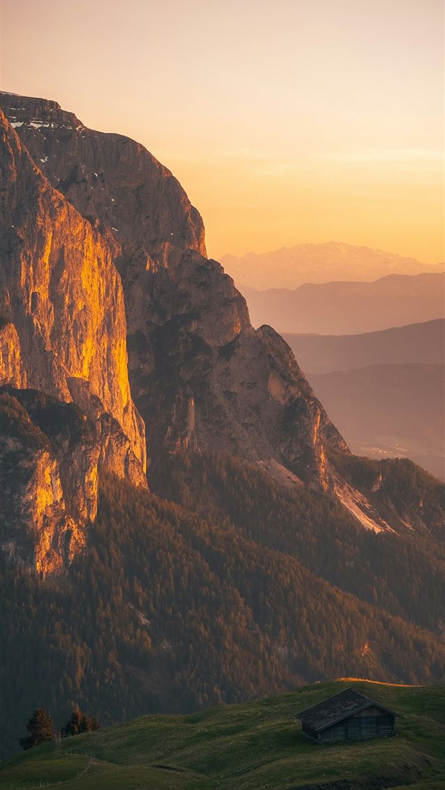 1290x2796 a view of a mountain range with a house in the for... -  iPhone Wallpaper