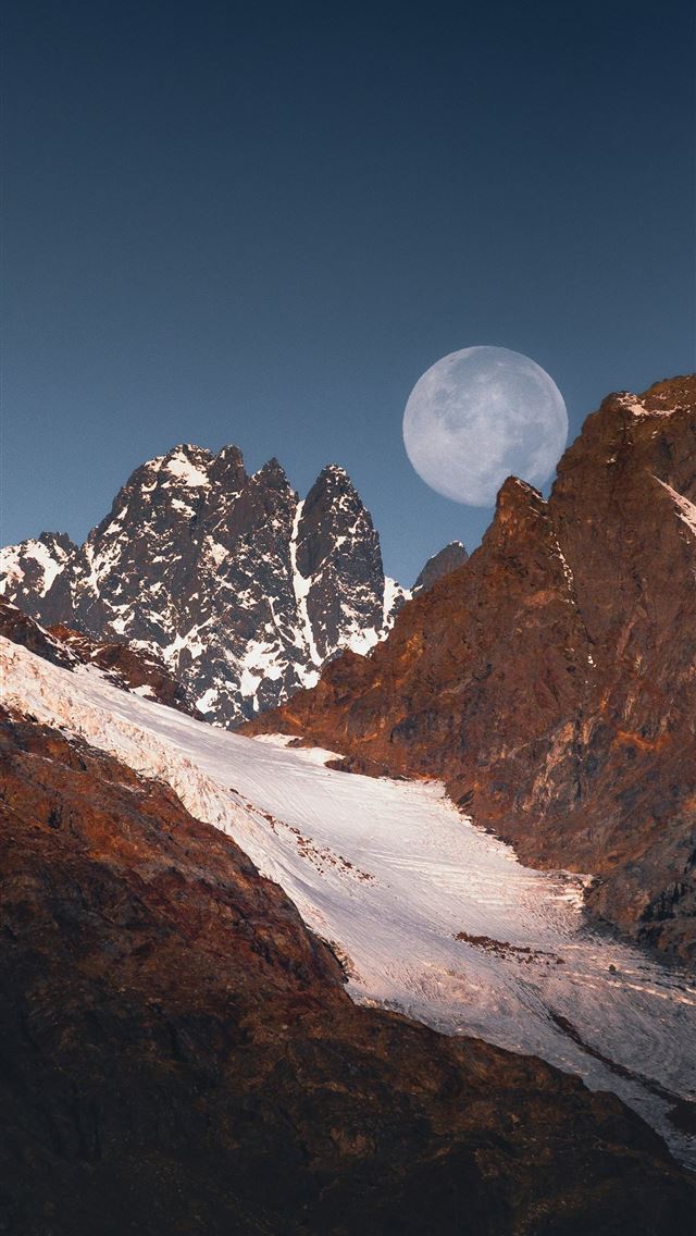 1290x2796 Full moon rises over snow capped rocky mountains  -  iPhone Wallpaper