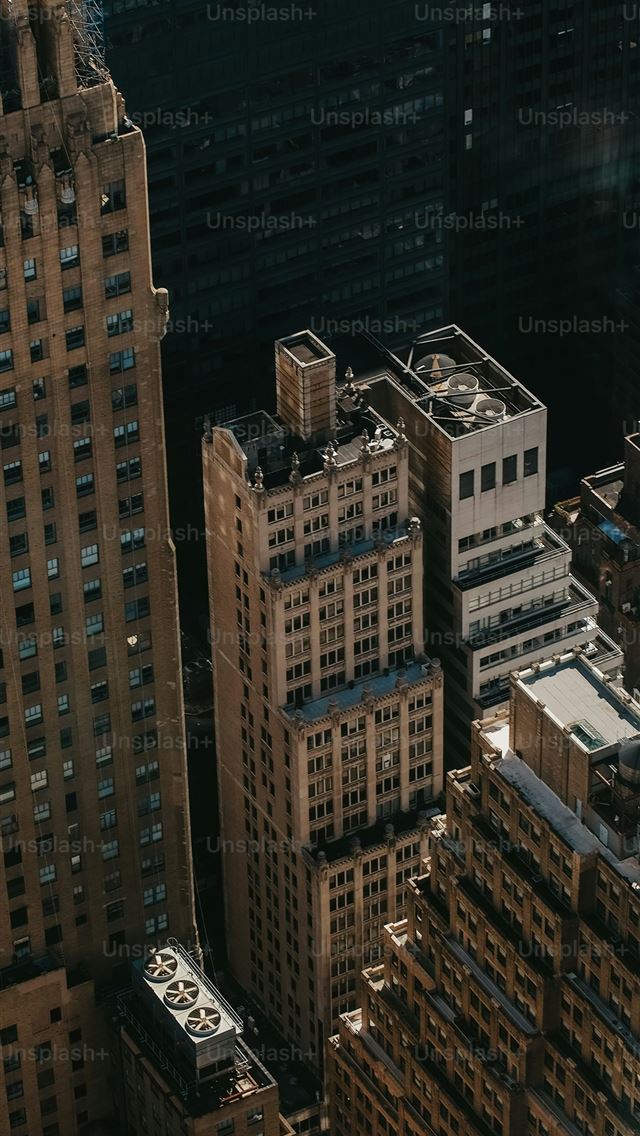 1290x2796 an aerial view of a city with tall buildings -  iPhone Wallpaper