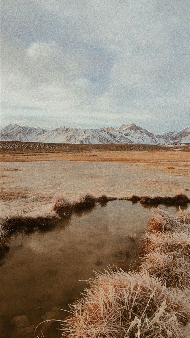 1290x2796 brown grass field near mountains under white cloud... -  iPhone Wallpaper