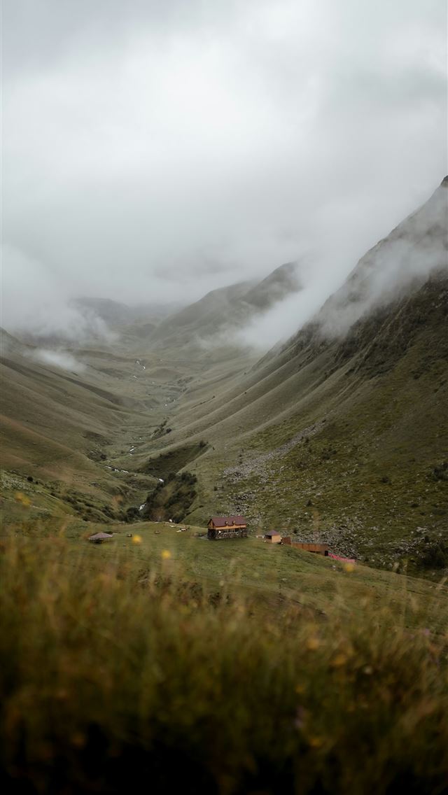 1290x2796 green grass field near mountain under white clouds... -  iPhone Wallpaper