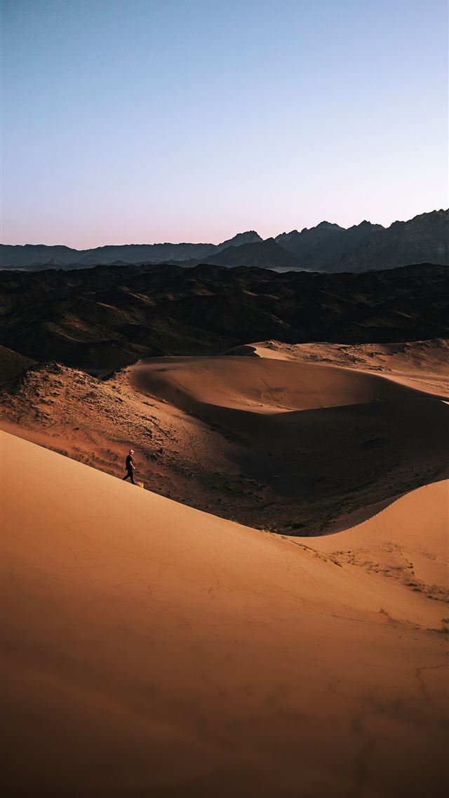 1290x2796 a person standing in the middle of a desert -  iPhone Wallpaper