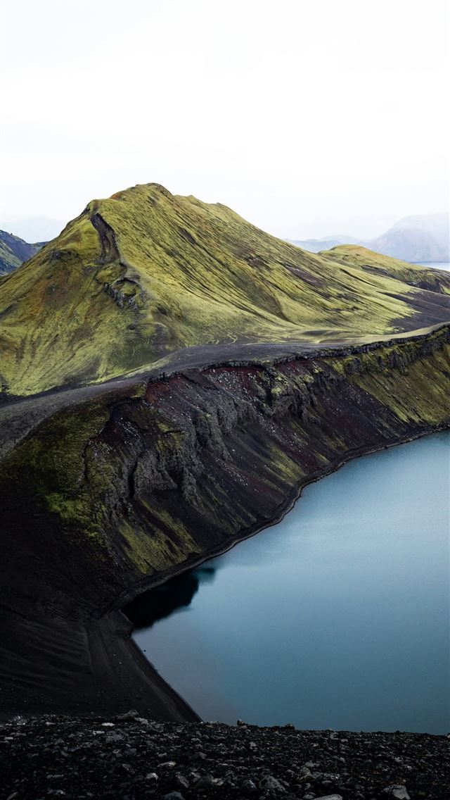 1290x2796 a large body of water surrounded by mountains -  iPhone Wallpaper