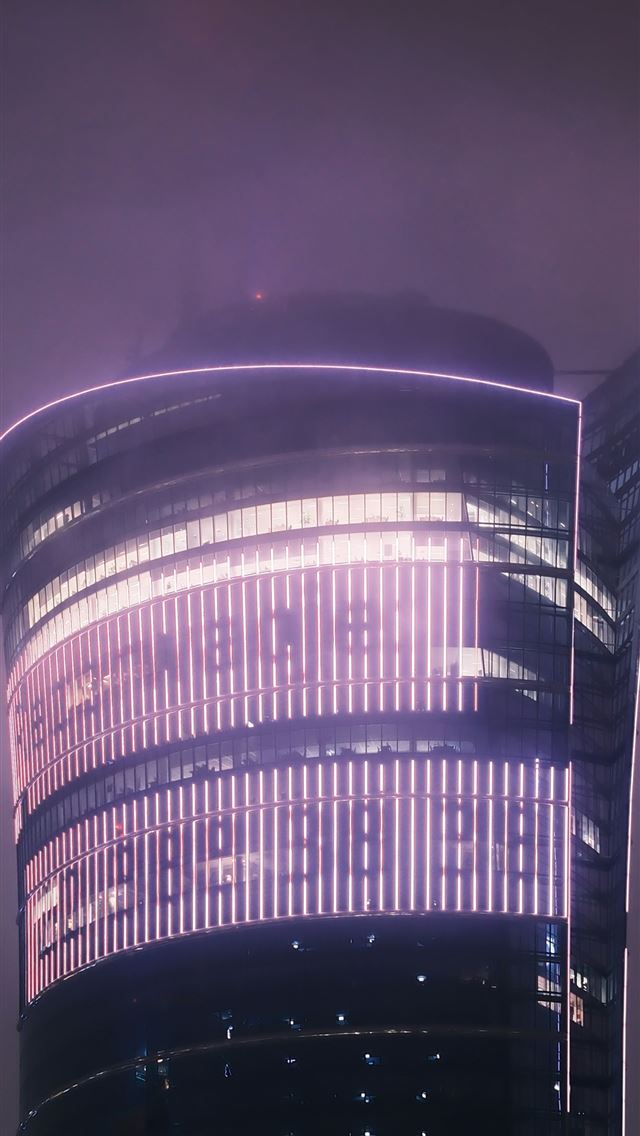1290x2796 a very tall building with a lot of lights on it -  iPhone Wallpaper