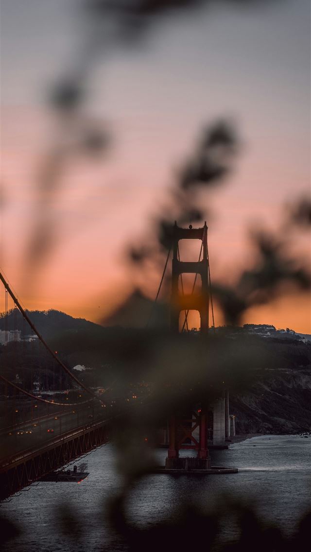 1290x2796 a view of the golden gate bridge at sunset -  iPhone Wallpaper