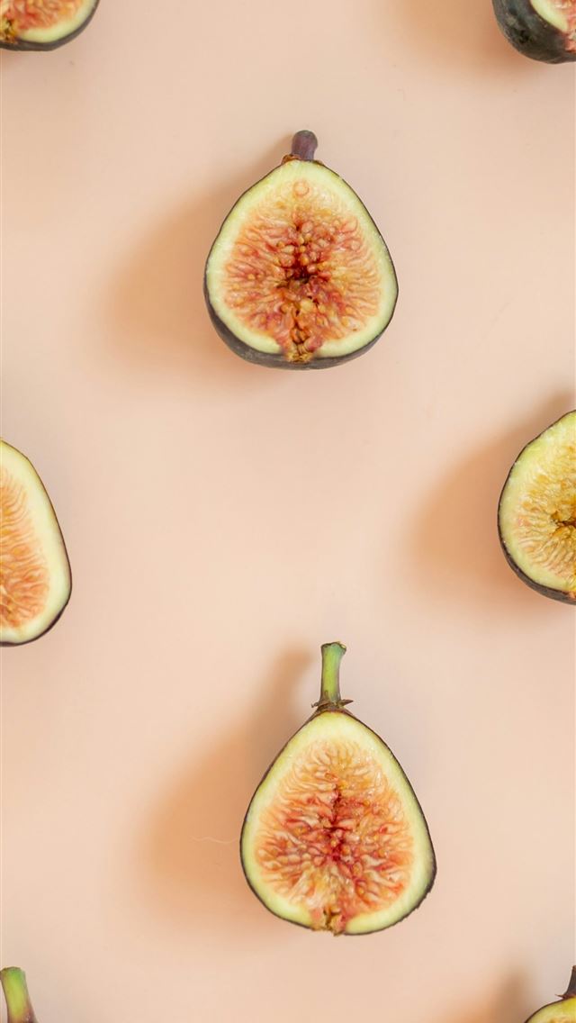 1290x2796 a group of sliced figs sitting on top of a table -  iPhone Wallpaper
