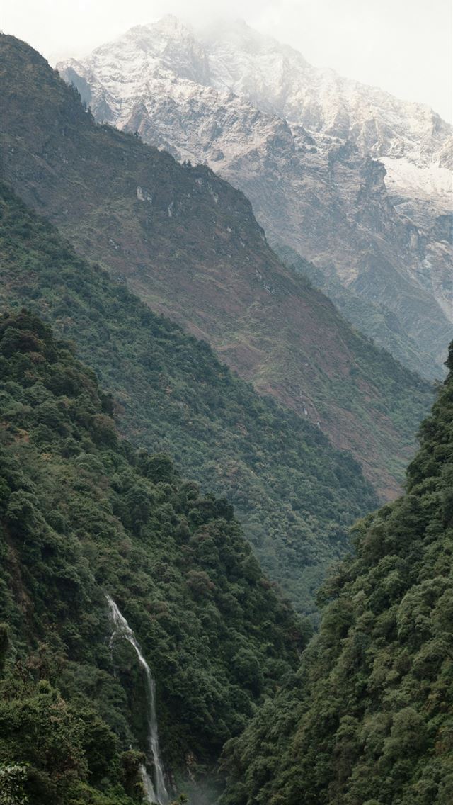 1290x2796 a mountain with a waterfall in the middle of it -  iPhone Wallpaper