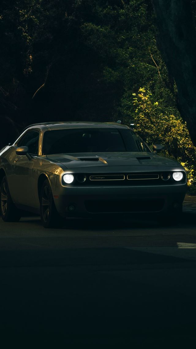 1290x2796 a car parked on the side of the road -  iPhone Wallpaper