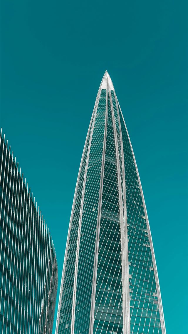 1290x2796 A couple of tall buildings sitting next to each ot... -  iPhone Wallpaper