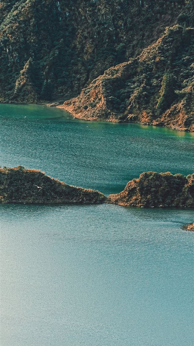 1290x2796 a large body of water surrounded by mountains -  iPhone Wallpaper