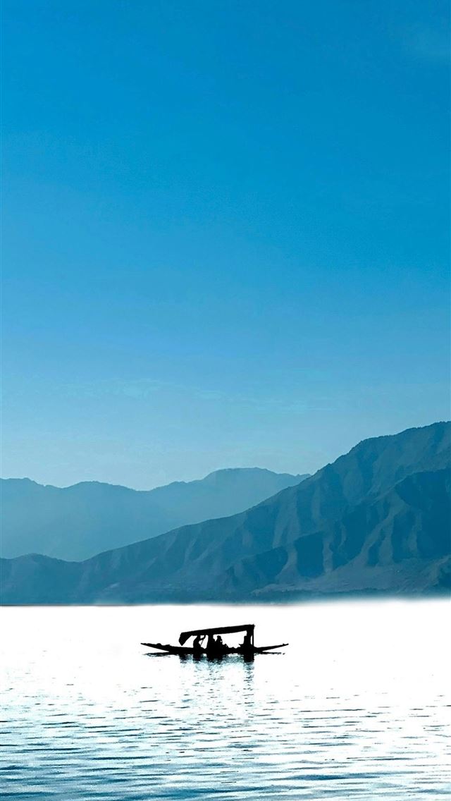 640x1136 two people in a small boat on a large body of wate... -  iPhone Wallpaper