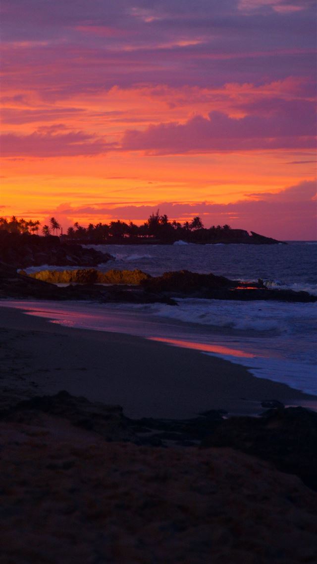 1290x2796 a sunset view of a beach with houses in the distan... -  iPhone Wallpaper