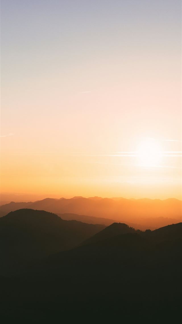 1290x2796 Sunset over silhouetted mountain ranges with paste... -  iPhone Wallpaper