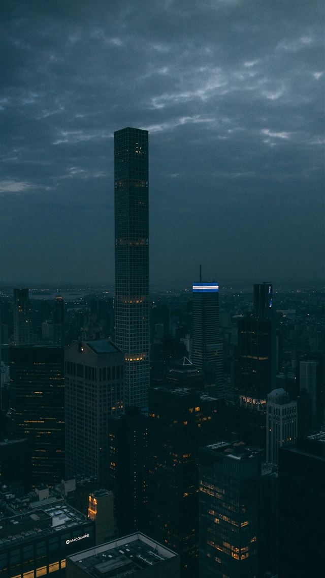 1290x2796 a view of a city at night from the top of a buildi... -  iPhone Wallpaper