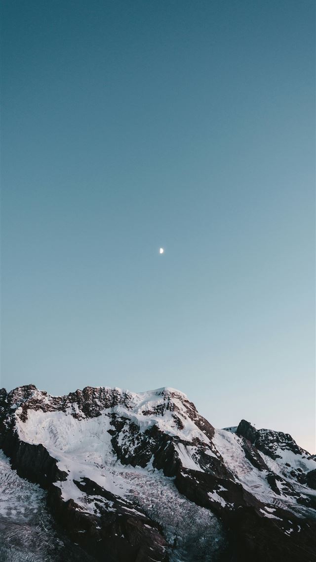1290x2796 a snow covered mountain under a blue sky -  iPhone Wallpaper