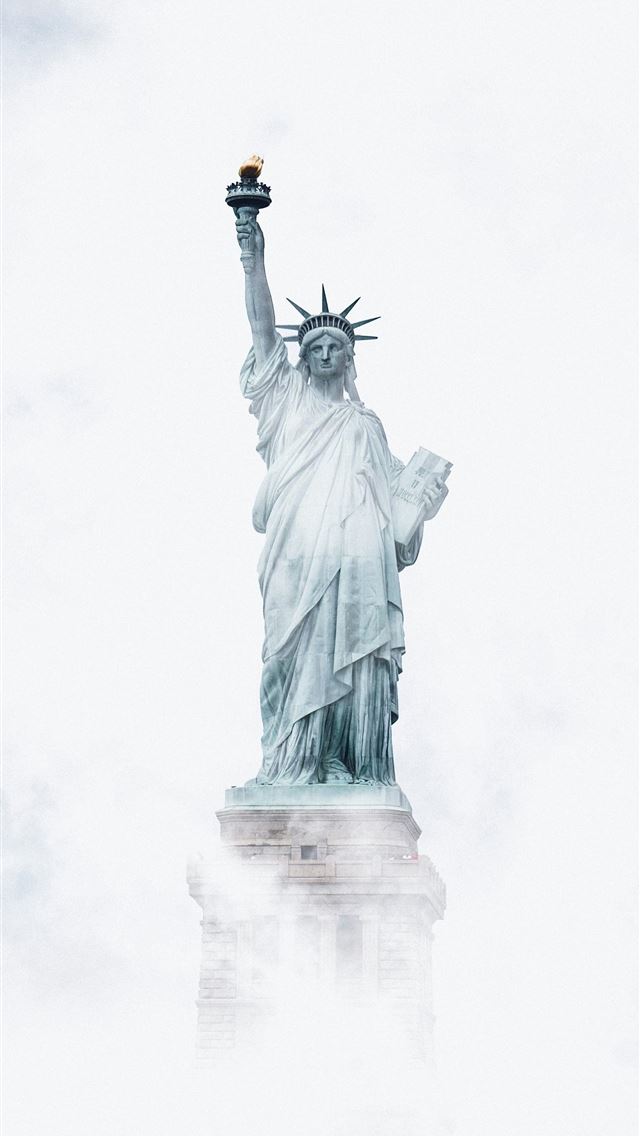 1290x2796 a statue of a person holding a torch -  iPhone Wallpaper