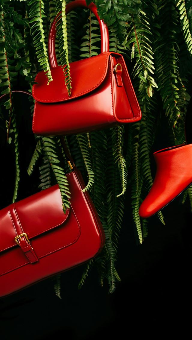 1290x2796 red leather handbag on green pine tree -  iPhone Wallpaper