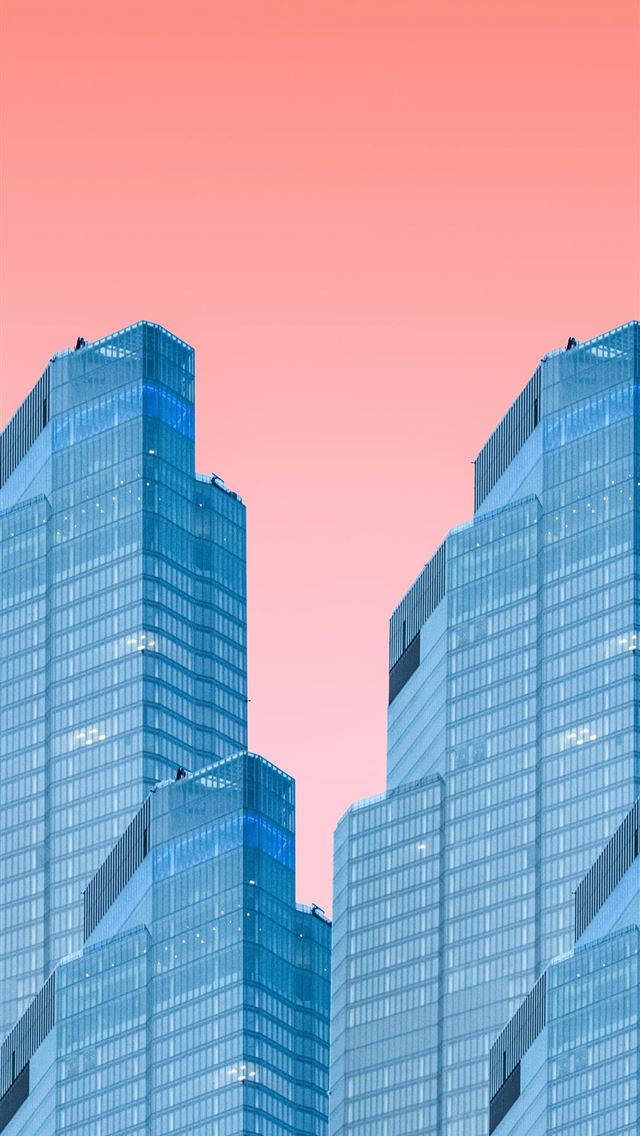1290x2796 a group of tall buildings with a pink sky in the b... - architecture iPhone Wallpaper
