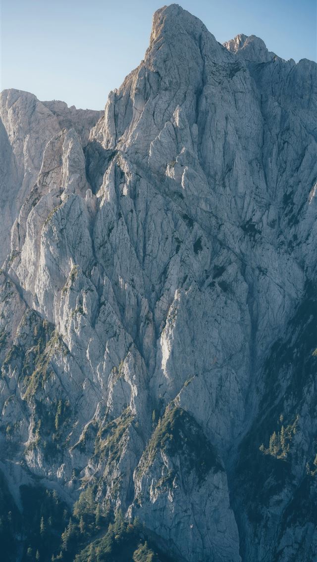 1290x2796 Jagged rocky mountain peak with green vegetation -  iPhone Wallpaper