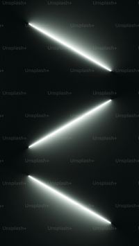 a black and white photo of a light in the dark wallpaper