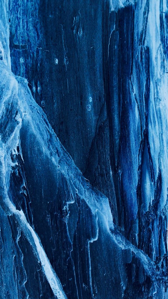 1290x2796 a man standing on top of a snow covered mountain - experimental iPhone Wallpaper